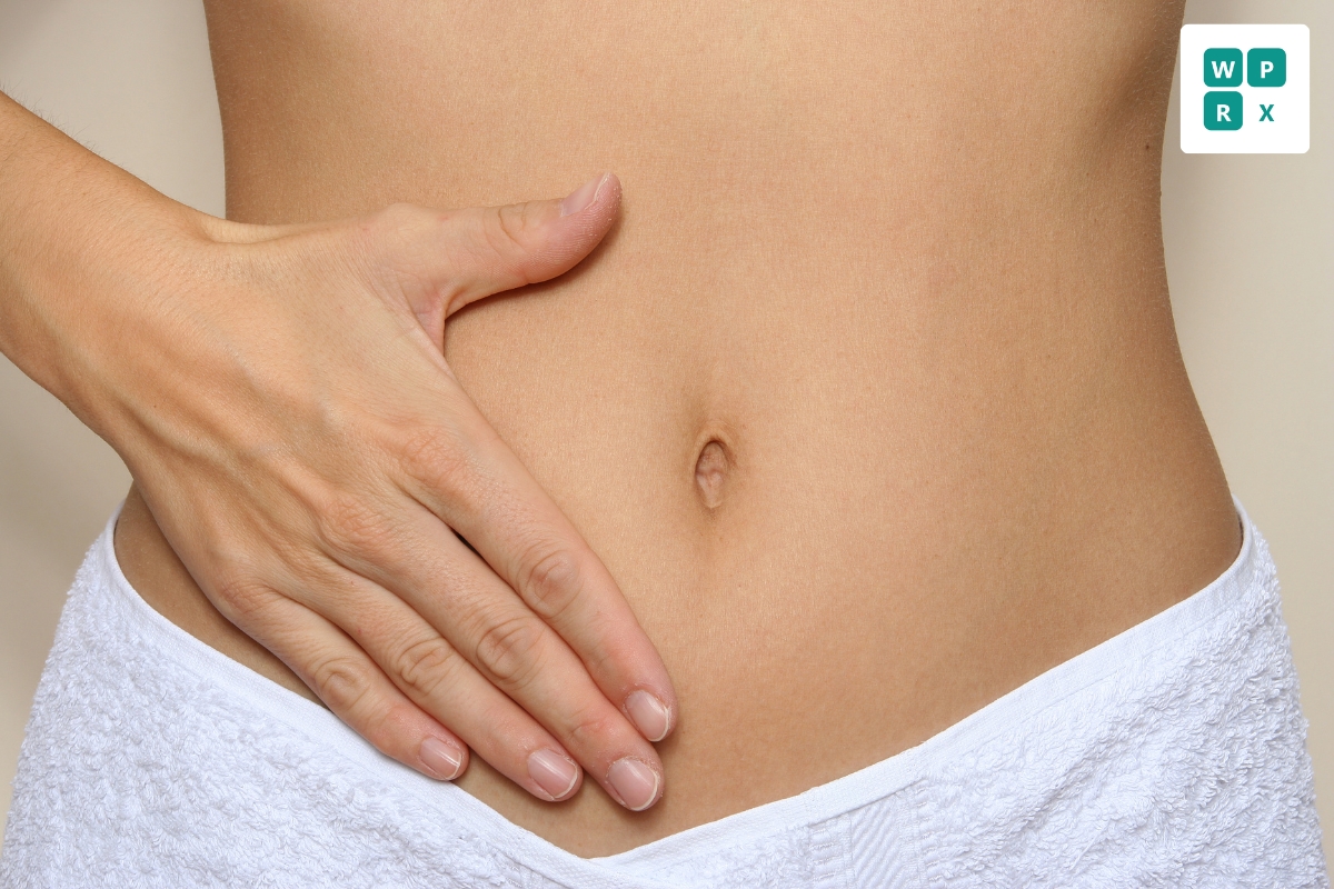 Close-up of a person's midsection with a hand resting on the abdomen — BPC-157 peptide therapy for tissue repair and recovery from WePeptideRx